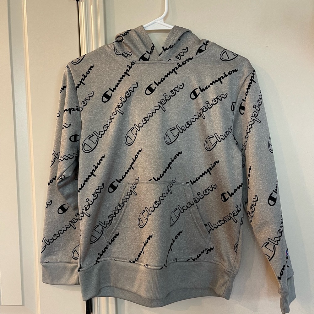 Boys gray Champion hoodie with black champion pattern size 10 / 12
